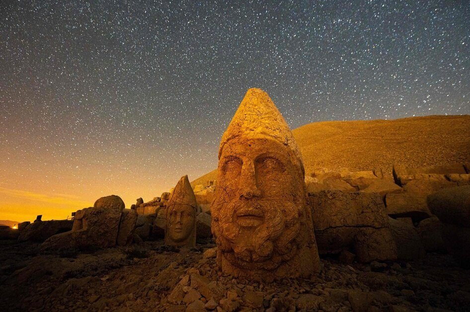 Mount Nemrut in Turkey with its giant ancient stone heads at sunrise, a top historical attraction for travelers