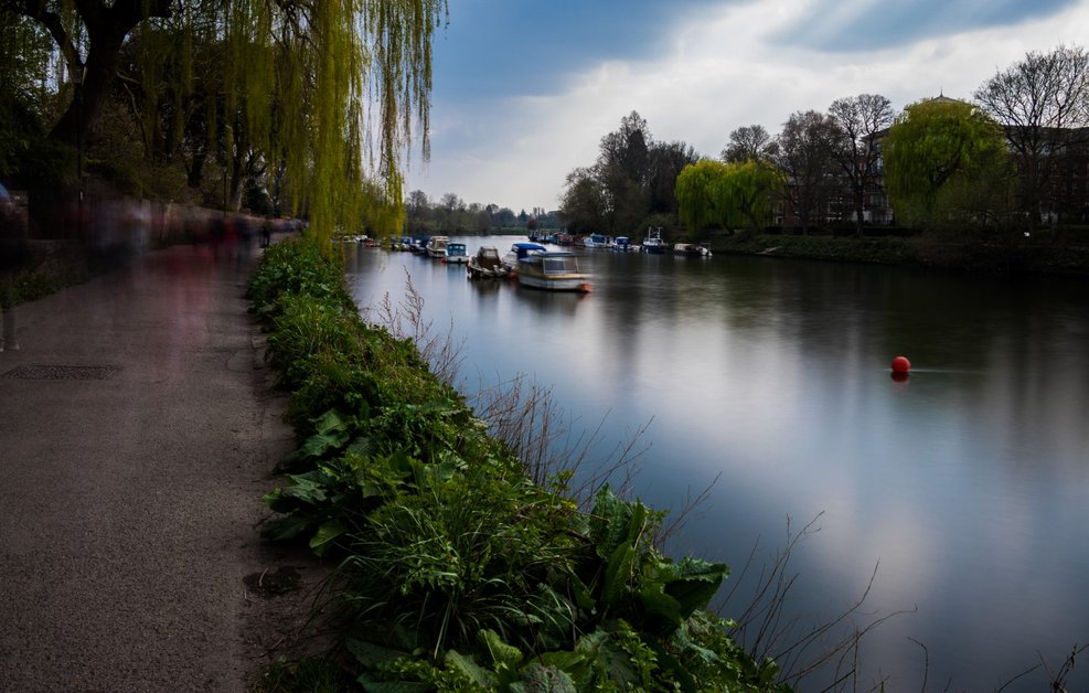 Scenic Canal Saint-Martin walk in Paris with people strolling along the water