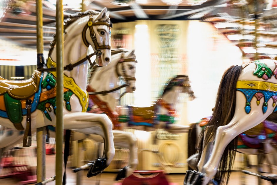 Vintage carousel ride in Paris with colorful lights and decoration