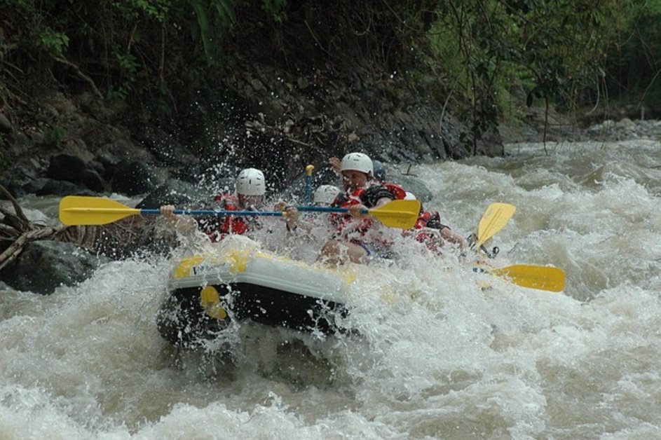 People enjoying white water rafting in Banff Canada
