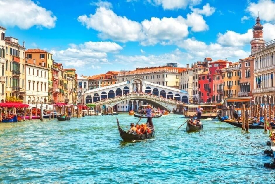 Gondola ride through Venice canals in Italy