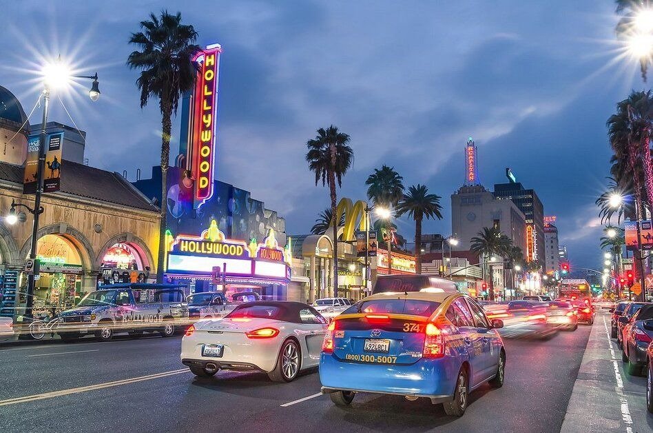 Night view of Sunset Strip nightlife in Los Angeles with bright lights and busy streets