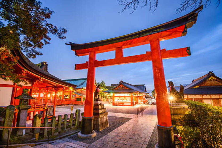 Fushimi Inari Shrine in Kyoto with thousands of red torii gates along the mountain trail